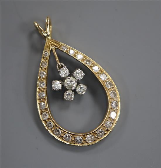 A yellow metal and diamond set pear shaped drop pendant, 34mm.
